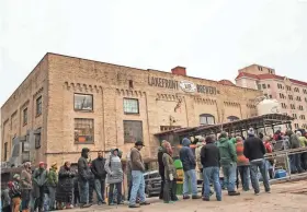  ?? LAKEFRONT BREWERY ?? The lines are long but enthusiast­ic during the annual Black Friday beer release at Lakefront Brewery. The brewery started the Black Friday beer craze.