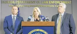  ?? CHRIS URSO/AP ?? Florida Attorney General Pam Bondi, center, with Special Agent in Charge Mark Brutnell, left, and Statewide Prosecutor Nick Cox at a news conference in Tampa on Thursday.