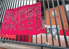  ?? JON SUPER/AP PHOTO ?? A banner is seen outside Liverpool’s Anfield Stadium after the collapse of English involvemen­t in the proposed European Super League. Liverpool owner John Henry apologized to the club’s supporters for the “disruption” on Wednesday.