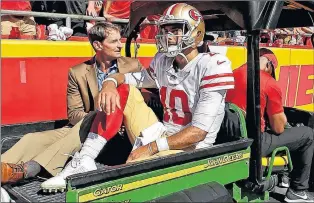  ?? AP PHOTO ?? San Francisco 49ers quarterbac­k Jimmy Garoppolo is carted off the field after being injured during the second half of a game against the Kansas City Chiefs in Kansas City, Mo., on Sept. 23.