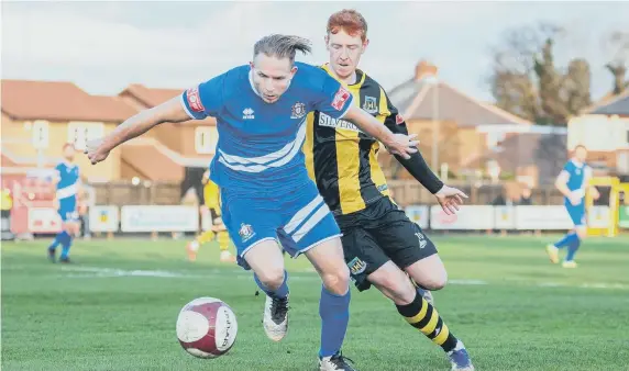  ?? ?? Action from Hebburn Town’s defeat against Marske United (blue).