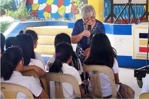  ?? — Nicole Renee David ?? YOUTH FORUM. Religious and Education Doctor and Speaker Elena ‘Jill’ Almandrez delivers a lecture to the female Grades 7 and Grade 8 students of San Isidro Integrated School.