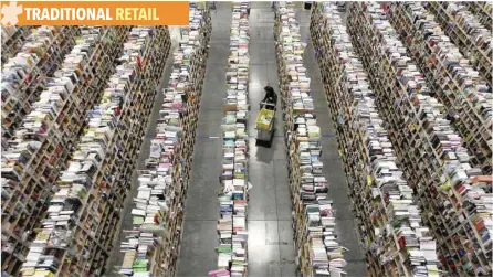  ?? — Reuters ?? A worker gathers items for delivery from the warehouse floor at Amazon’s distributi­on centre in Phoenix, Arizona.