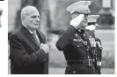  ??  ?? President Donald Trump did not participat­e in ceremonies to honour US war dead due to bad weather. His chief of staff, John Kelly, (left) went to the event instead