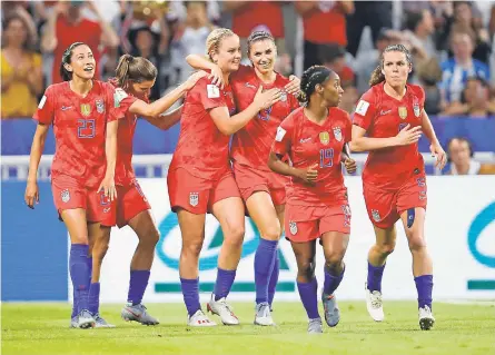  ?? MICHAEL CHOW/USA TODAY SPORTS ?? Alex Morgan celebrates with teammates after scoring a goal against England in the first half.