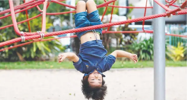  ?? Picture: BRENDAN RADKE ?? NET WORK: School holidays provides the perfect opportunit­y for St Therese's prep student Luca Takai, 5, to hang around and chill out.