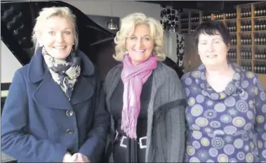  ??  ?? ■ ‘Something to Sing About’ choir members Bernie O’Donnel, Berna Kavanagh and musical director Maria Campbell.