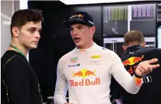  ?? Getty ?? Red Bull driver Max Verstappen with DJ Martin Garrix in the Red Bull Racing team garage at Yas Marina Circuit, Abu Dhabi