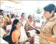  ??  ?? A policewoma­n checks the age proof of women devotees at the Sabarimala Temple on November 16. HT FILE