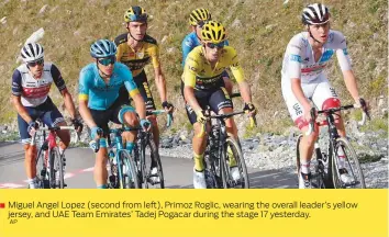  ?? AP ?? ■
Miguel Angel Lopez (second from left), Primoz Roglic, wearing the overall leader’s yellow jersey, and UAE Team Emirates’ Tadej Pogacar during the stage 17 yesterday.