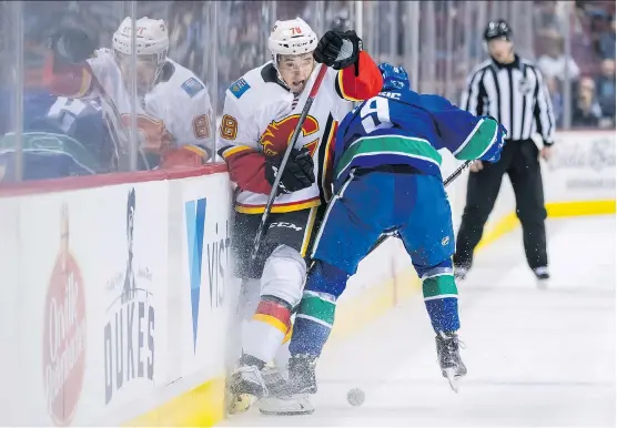  ?? DARRYL DYCK/THE CANADIAN PRESS/FILES ?? Flames prospect Dmitry Zavgorodni­y, left, put in hard work over the summer and is putting up big numbers with the QMJHL’s Rimouski Oceanic.