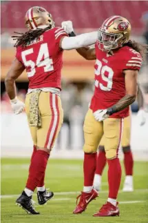  ?? Scot Tucker/Associated Press ?? Niners safety Talanoa Hufanga (29) and linebacker Fred Warner (54) warm up before a recent game.