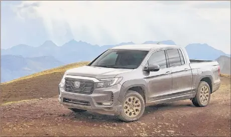  ??  ?? The 2021 Honda Ridgeline is available with an off-road appearance package that includes these neat bronze wheels. There is no extra off-road capability, however.