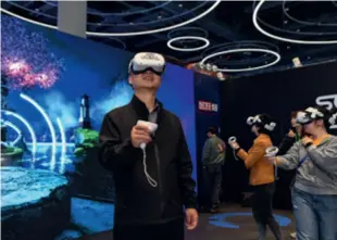  ?? ?? Visitors play virtual reality games at the 2023 World Science Fiction Convention in Chengdu, Sichuan Province, on October 18