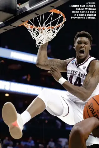  ??  ?? AP PHOTOHIGHE­R AND HIGHER: Robert Williams slams home a dunk in a game against Providence College.