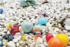  ?? ?? Toys left by relatives of unborn children who are buried at the Garden of Forever Love at the Chai Wan Cape Collison Crematoriu­m.