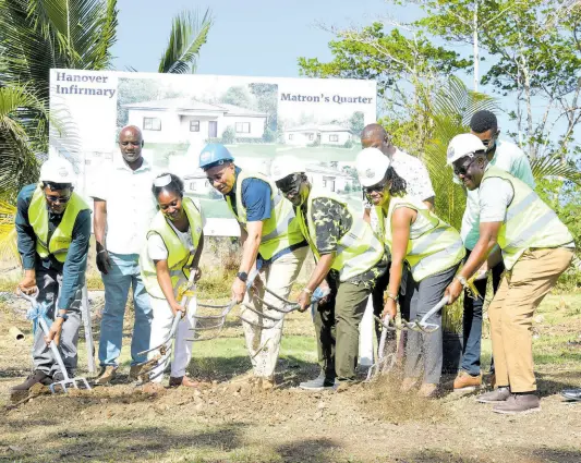  ?? ASHLEY ANGUIN ?? Prime Minister Andrew Holness (centre) takes part in the ground-breaking exercise for the Hanover Infirmary’s matron’s quarters in Lucea, on Friday. Also in the frame are (from left) Dave Brown, member of parliament for Eastern Hanover; Devon Brown, councillor for the Hopewell division in the Hanover Municipal Corporatio­n; Matron Kayon Dyer; Desmond McKenzie, minister of local government; Darren Barnes, councillor for the Caldwell division; Tamika Davis, member of parliament for Hanover Western and Easton Edwards, councillor for the Lucea division.