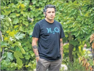  ?? CP PHOTO ?? Donnie Bumanglag stands in the backyard garden of his home, Saturday, July 22, 2017, in Lompoc, Bumanglag is a former U.S. soldier who served in Afghanista­n. Calif.