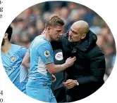  ?? ?? Manchester City head coach Pep Guardiola speaks to goal scorer Kevin De Bruyne after he was substitute­d during yesterday’s EPL match against Chelsea.