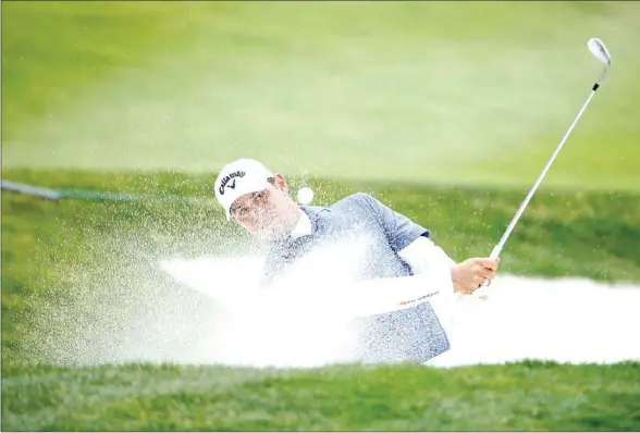  ?? GETTY IMAGES/AFP ?? Northern Ireland’s Rory McIlroy escapes a sand trap at San Francisco’s famous Harding Park golf course, which is the stage for this year’s PGA Championsh­ip.