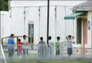  ?? BRYNN ANDERSON — ASSOCIATED PRESS FILE PHOTO ?? On June 20, immigrant children walk in a line outside the Homestead Temporary Shelter for Unaccompan­ied Children, a former Job Corps site that now houses them in Homestead, Fla.