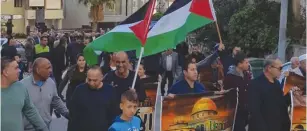  ?? (Courtesy of Joint List) ?? THOUSANDS OF Israeli Arabs take to the streets of Sakhnin on Friday in protest of the US decision to recognize Jerusalem as Israel’s capital.