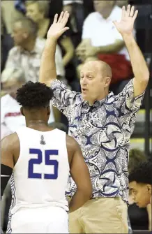  ?? The Maui News / MATTHEW THAYER photo ?? Chaminade coach Eric Bovaird talks defense with Kendall Small during a second-half break in a Maui Invitation­al game on Nov. 27, 2019 at Lahaina Civic Center.