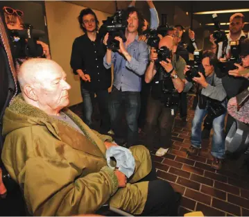  ?? (Reuters) ?? CONVICTED NAZI death-camp guard John Demjanjuk leaves a courtroom after his the verdict in Munich in 2011.