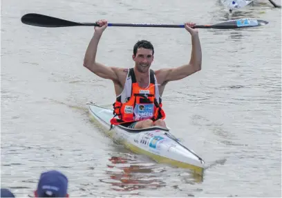  ?? Picture: Gallo Images ?? NINTH TITLE. A delighted Andy Birkett crosses the finish line to win the Dusi Canoe Marathon from Pietermar- itzburg to Durban on Saturday.