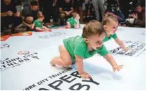  ?? REUTERS ?? Babies compete in the 2017 ‘Diaper Derby’ crawling race, a promotion event ahead of the New York City Triathlon in New York City on Friday.
