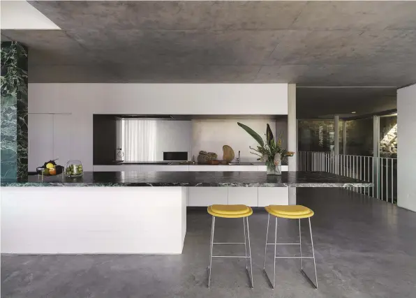  ??  ?? THIS PAGE in the kitchen, Cappellini Hi Pad stools from Cult; benchtop and concealed bar cabinetry (to the left) in leathered Esmeralda marble.