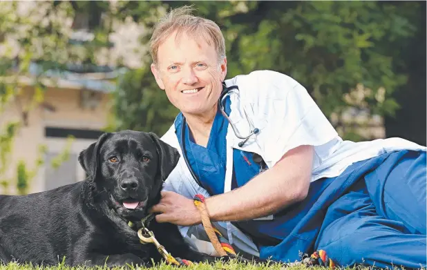  ?? Picture: TIM CARRAFA ?? NEW LEASE ON LIFE: Royal Melbourne Hospital senior cardiologi­st Joe Morton with Harvey who had heart surgery to correct a dangerous condition.