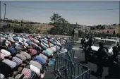  ?? PICTURE: AP ?? Muslim worshipper­s were prevented from entering the Al-Aqsa Mosque to pray outside Jerusalem’s Old City yesterday. Israel’s police chief said two officers were killed in an attack by assailants near a Jerusalem shrine.