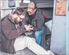  ?? CONTRIBUTE­D ?? Gary Axworthy of Waves Media and Dylan Yates, president of Cape Breton Environmen­tal Associatio­n, check the overhead drone positionin­g while filming in False Bay, near Waddens Cove just outside Port Morien.