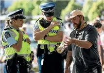  ??  ?? Queenstown police spent Christmas Day reminding revellers of the town’s 8pm liquor ban. GEORGE HEARD/STUFF