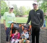  ??  ?? First-time participan­t Lindsey Stevens of Charlton (left) with her family at the Saratoga Performing Arts Center’s annual Rock & Run fundraiser on Sunday in the Saratoga Spa State Park.