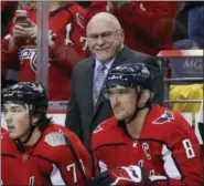  ?? ALEX BRANDON — THE ASSOCIATED PRESS FILE ?? In this file photo, Washington Capitals head coach Barry Trotz smiles towards left wing Alex Ovechkin, right, after Ovechkin’s goal in the second period of an NHL hockey game against the Winnipeg Jets, in Washington. Trotz has resigned as coach of the...