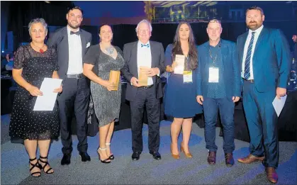  ?? PICTURE / SUPPLIED ?? WINNERS: Theresa Burkhardt (FNDC, left), Cr Felicity Foy (third right) and Greg Wilson (FNDC, second right) at the NZPI awards dinner. Also pictured are David Badham (Barker and Associates), Fran Mukilicic (Kaipara District Council), Whangarei...