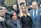  ??  ?? Russia’s foreign minister Sergey Lavrov right, poses with members of a far-Right proRussian group of which suspect Nemanja Ristic, left, is a member