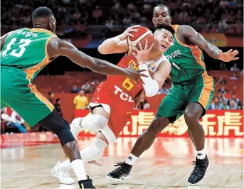  ??  ?? China’s Guo Ailun in action on Saturday against the Ivory Coast in the FIBA World Cup, first round, Group A match at Wukesong Arena in Beijing. — Reuters