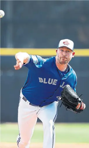  ?? JOE ROBBINS/GETTY IMAGES ?? Veteran reliever John Axford was in Blue Jays pyjamas when he was an 11-year-old fan.