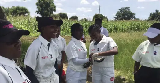  ?? ?? Some of the girls taking part in the women's developmen­tal cricket league dressing up uniforms provided by YASD in Glen view last week