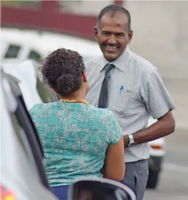  ?? Photo: Ronald Kumar ?? Fiji Sun Deputy Managing Editor/News Selita Bolanavanu­a catches up with Rishi Ram after he leaves the FijiFirst Party office in Brown Street, Suva, on August 18, 2018.