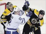  ?? ELISE AMENDOLA THE ASSOCIATED PRESS ?? Patrick Marleau struggles for position against Bruins’ Zdeno Chara in front of Boston goaltender Tuukka Rask on Thursday night.