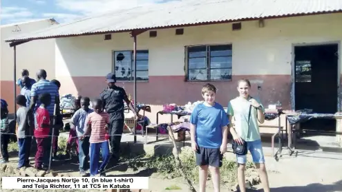  ??  ?? Pierre-Jacques Nortje 10, (in blue t-shirt) and Teija Richter, 11 at TCS in Katuba