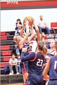  ?? Barbara hall ?? A Sonoravill­e player battles a Heritage girl for a rebound during the teams’ Region 7-4A showdown last Friday night at The Furnace.