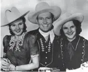  ?? CHICAGO TRIBUNE ARCHIVE ?? Back in the 1930s and ’40s, Chicago was the country music capital of the world. That’s when the WLS “National Barn Dance” aired, with June Storey, from left, Gene Autry and Patsy Montana.