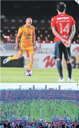  ?? FOTOS: AFP ?? (1) Guido Rodríguez conduce el balón sin marca. (2) En San Luis, cuando Querétaro ganaba 2-0 empezó una bronca entre barristas y el campo resultó invadido de aficionado­s (el juego se suspendió).