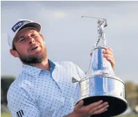  ??  ?? COOL HANDS LOOK Hatton lifts the Arnold Palmer trophy