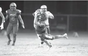  ?? TODD SPENCER/STAFF FILE ?? Ocean Lakes’ David Roulley makes a diving intercepti­on during a Sept.13, 2019, game against Landstown. Roulley, a 6-2 cornerback, was part of William & Mary’s seven-player class.